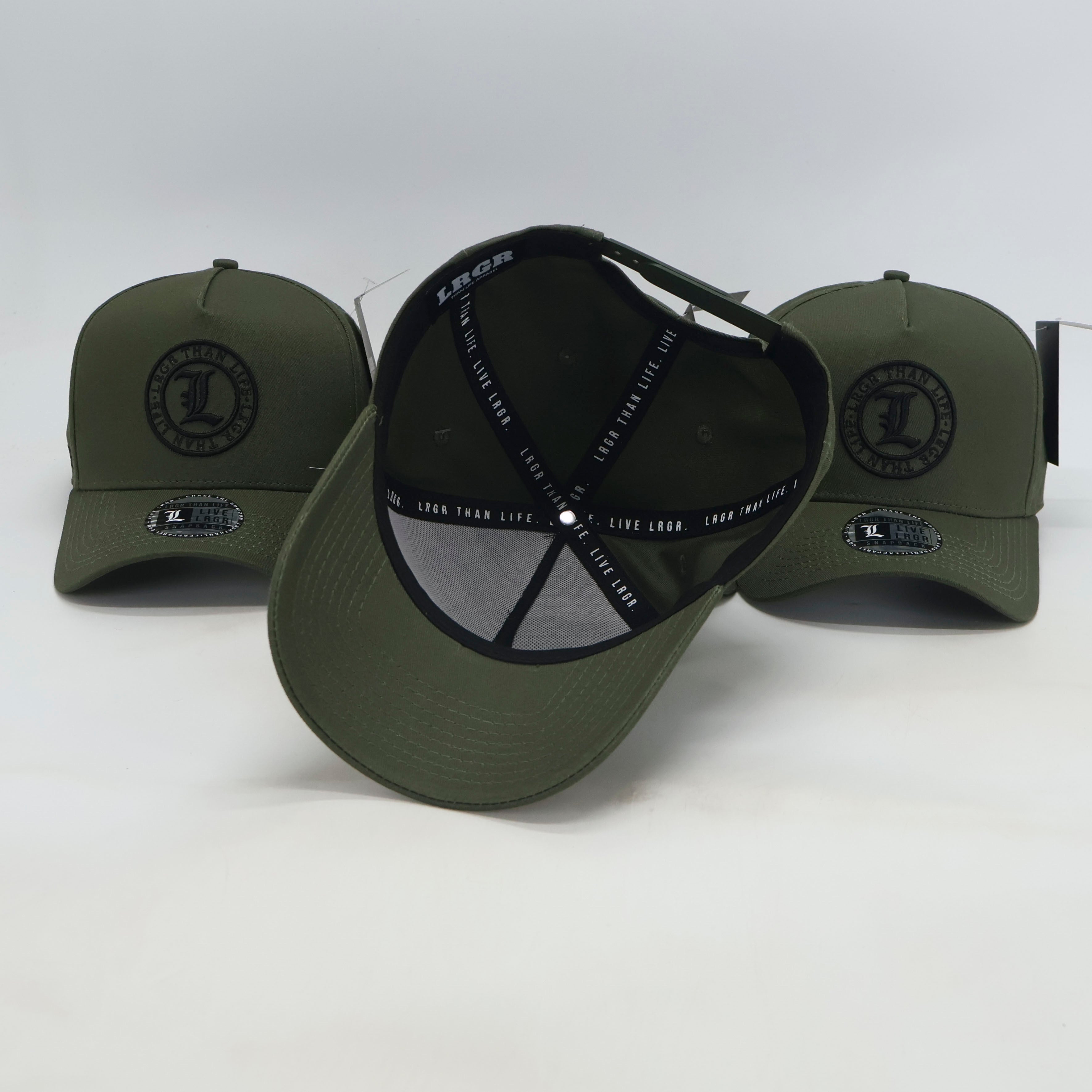 Three green baseball caps with black logos on a white background