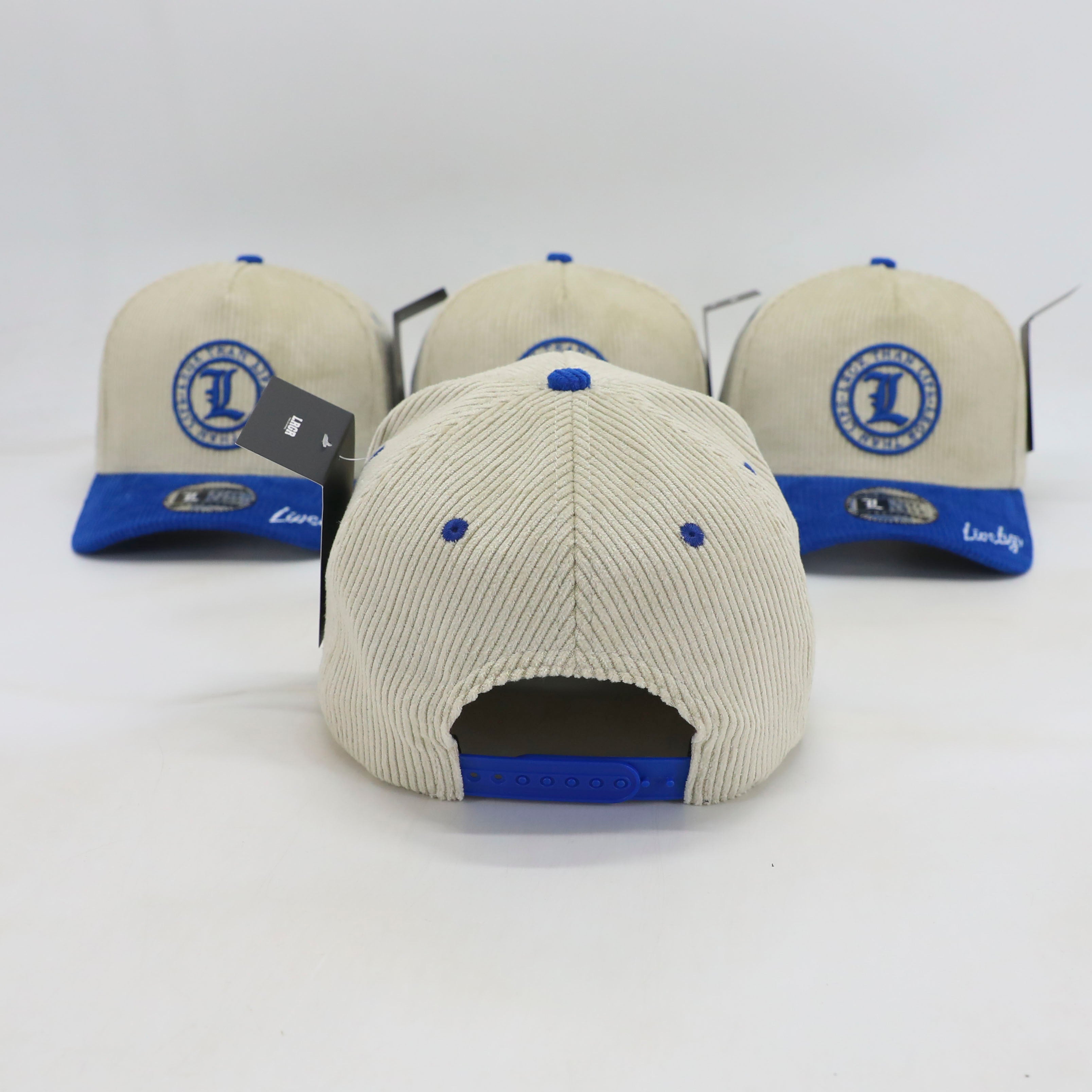 Three caps with blue and beige design on a white background