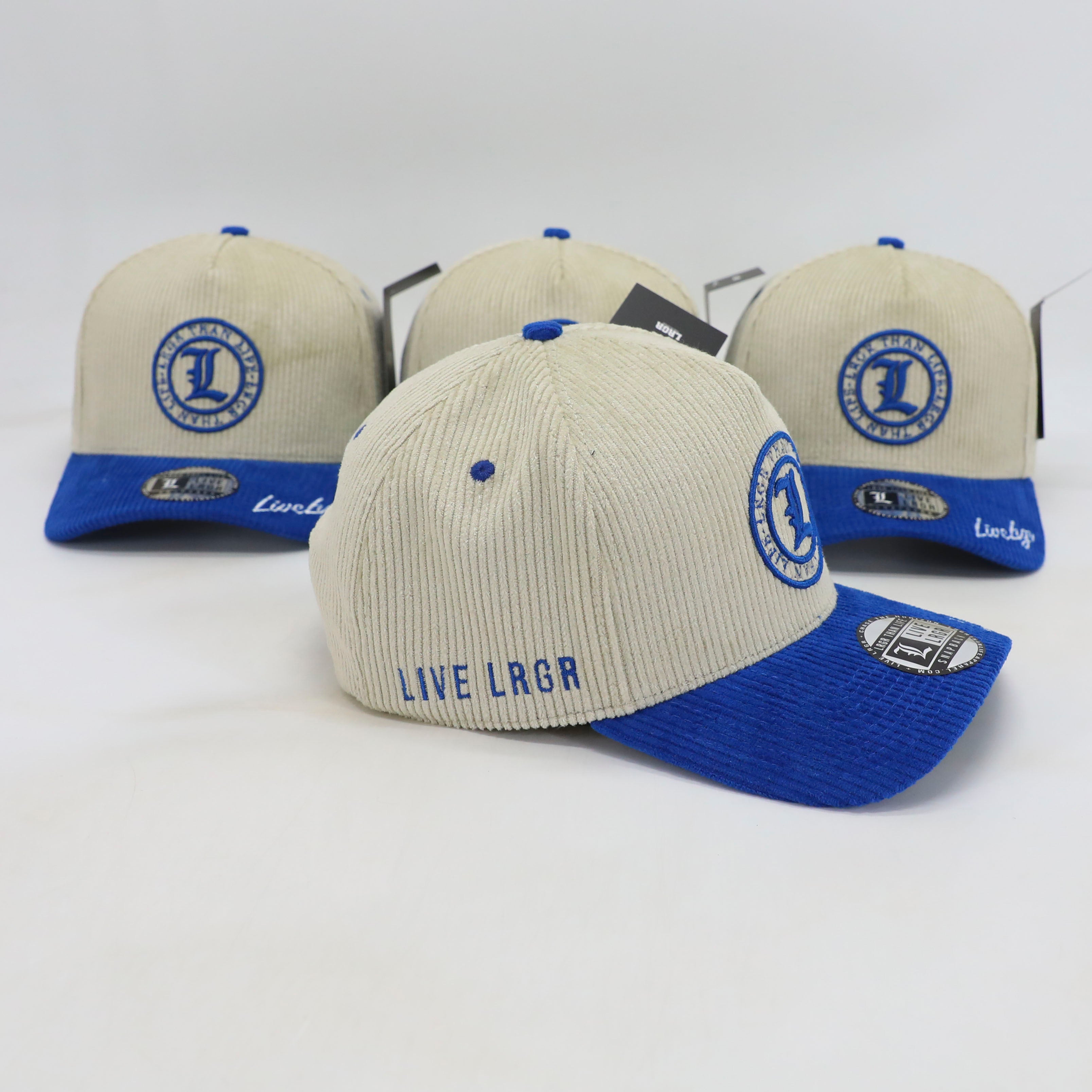 Three caps with blue and beige design on a white background