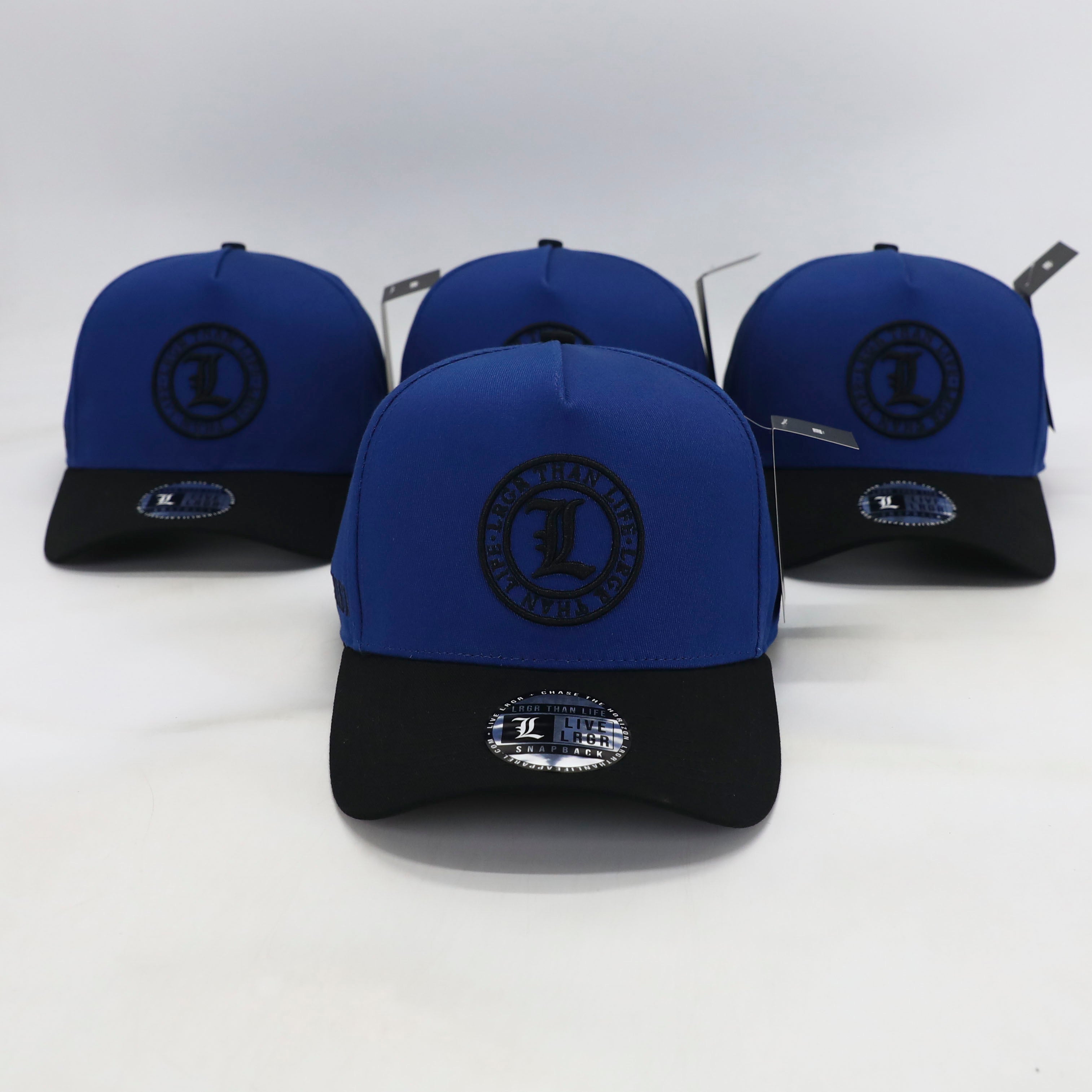 Blue and black caps with a logo on a white background