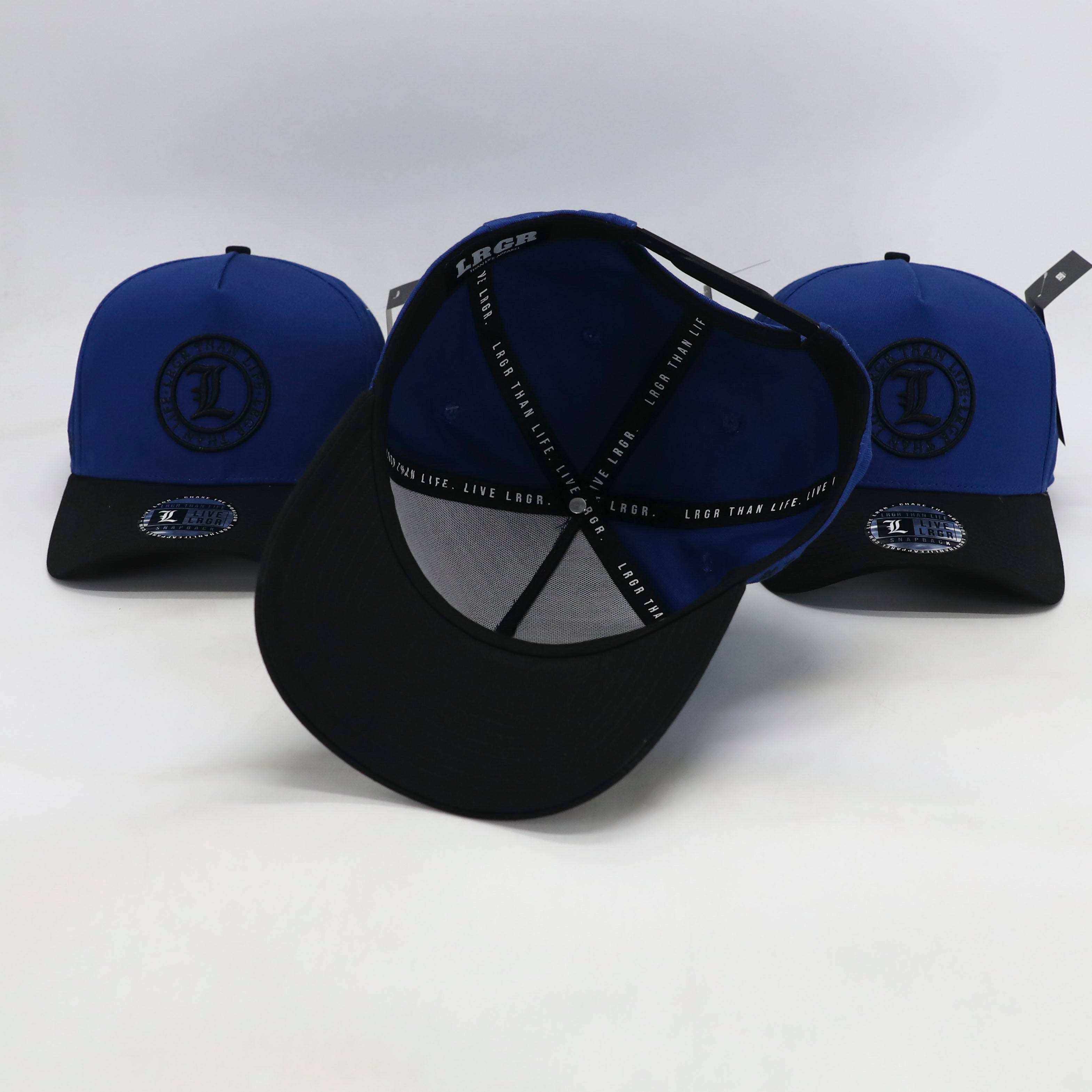 Three black and blue caps with logos on a white background