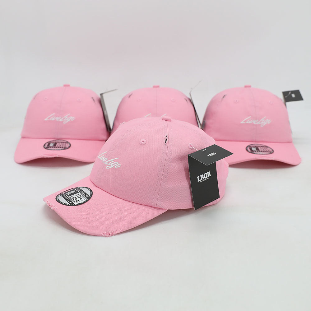 Three pink dad hats with the text 'LUVIG' on them placed against a white background.