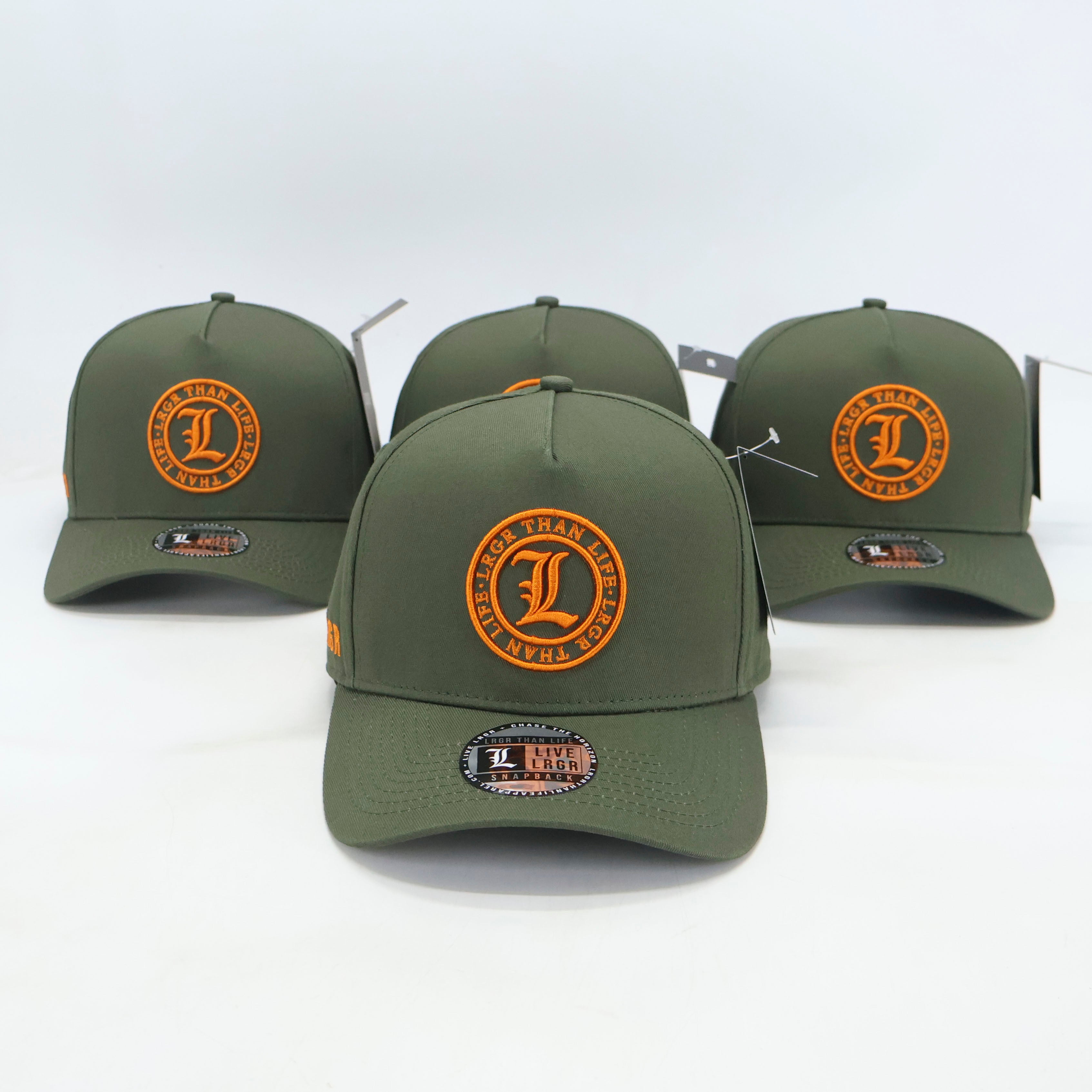 Three green baseball caps with orange logos on a white background