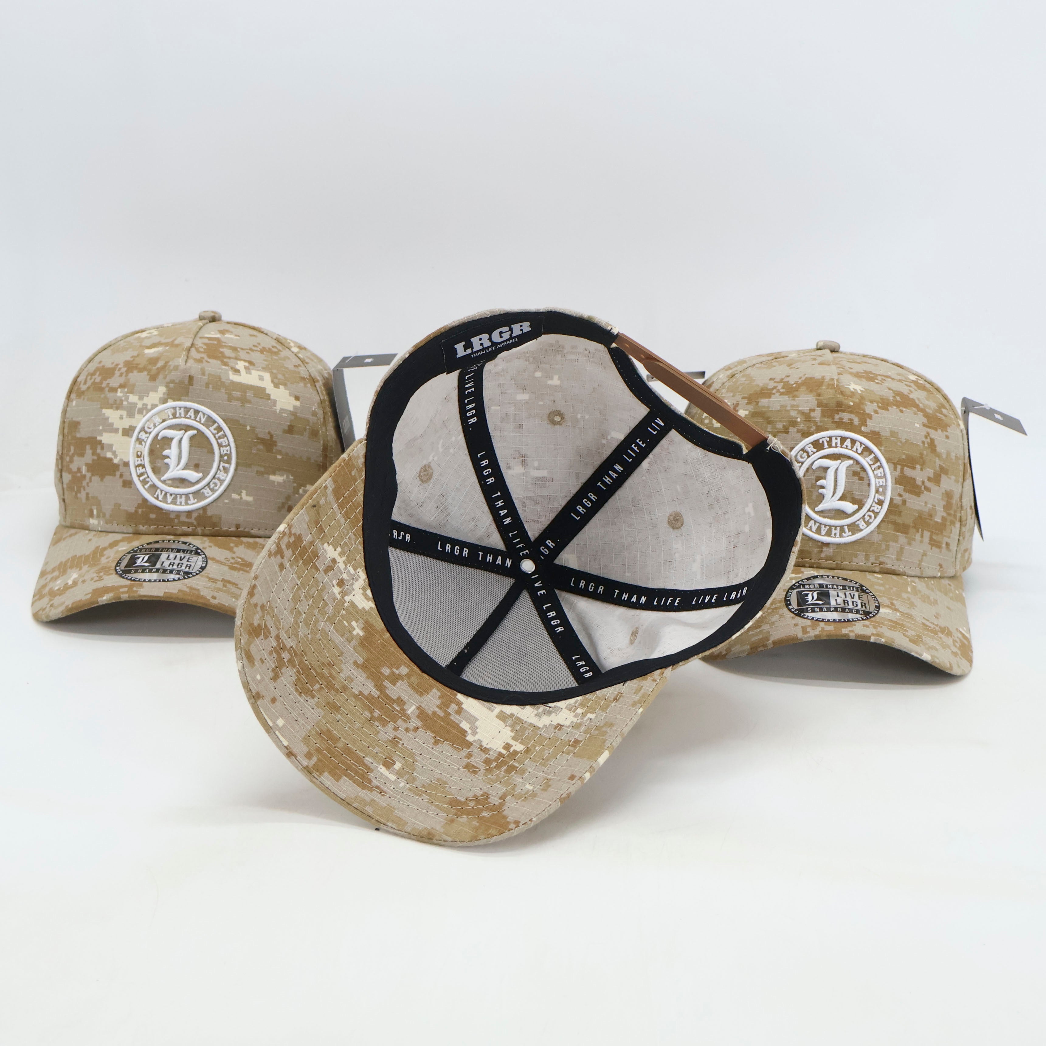 Three camouflage baseball caps with visible branding on a white background
