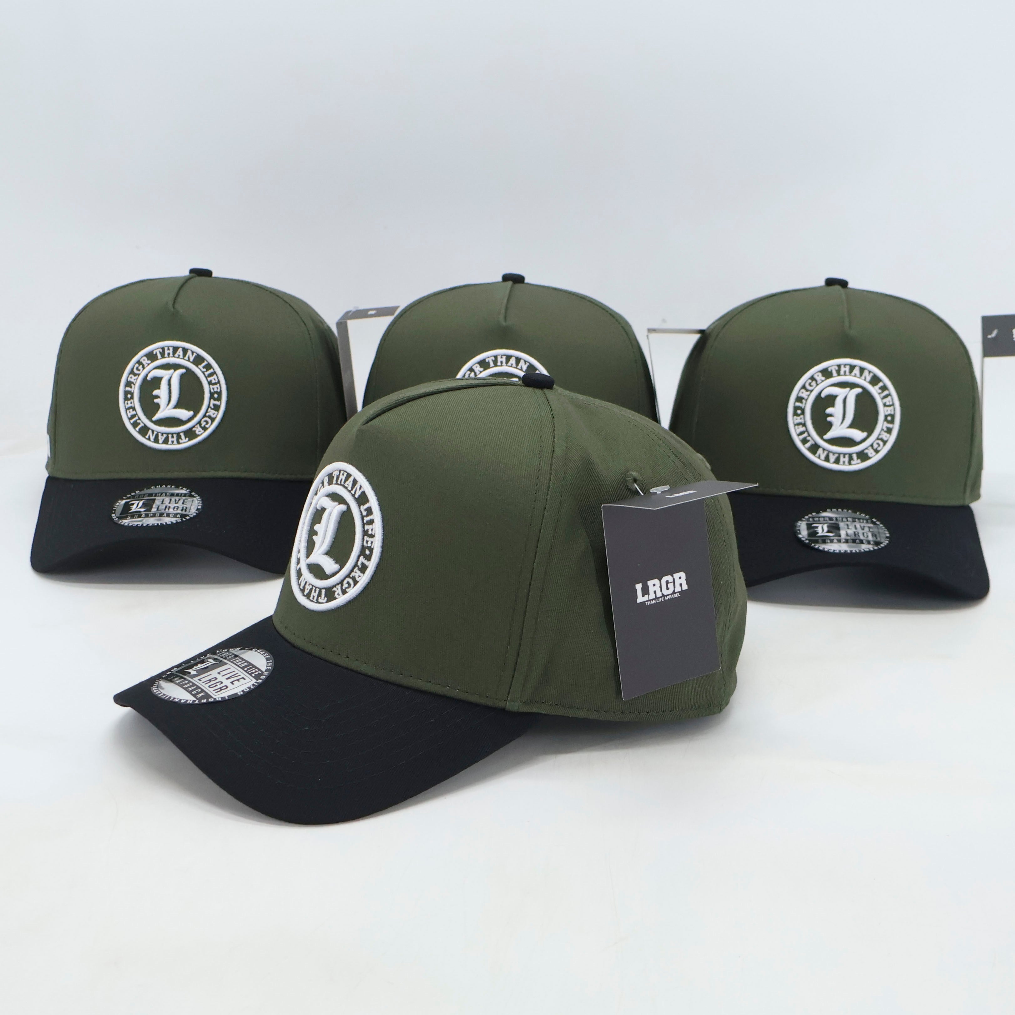 Four green and black caps with a brand logo on a white background