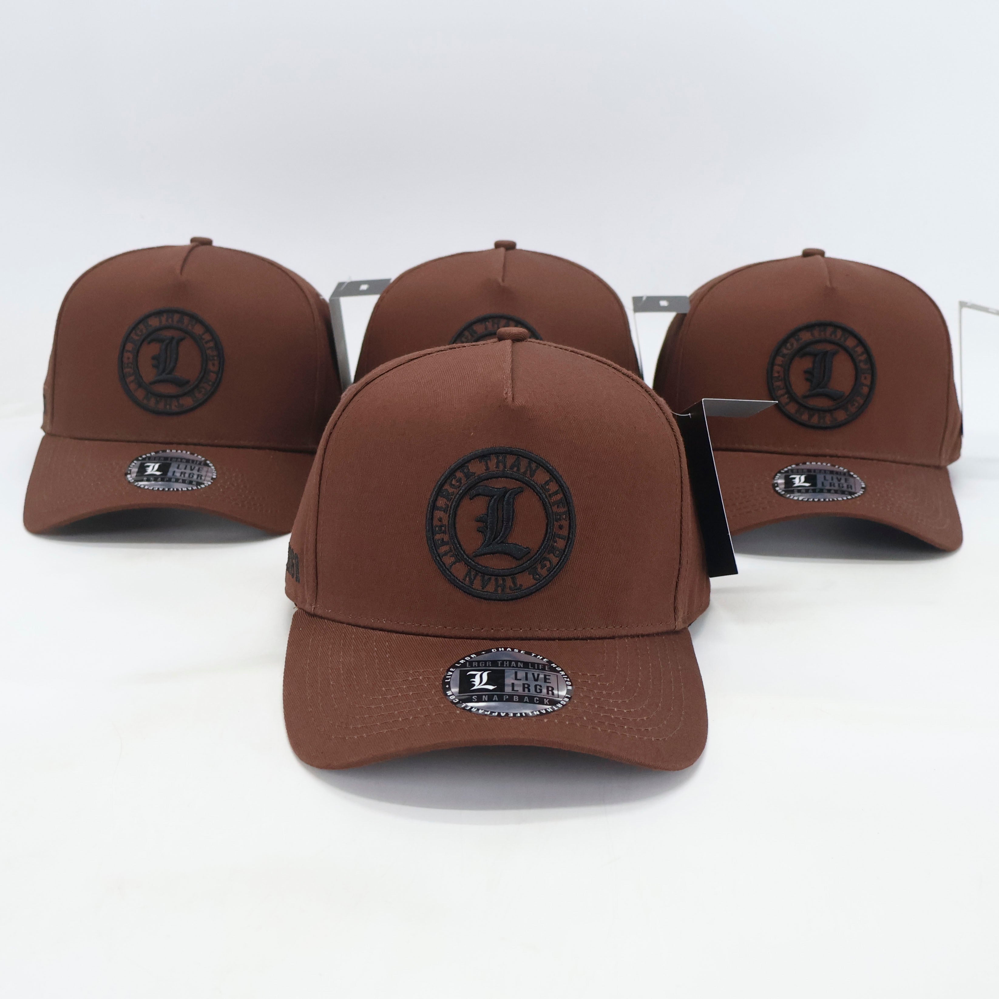 Four brown baseball caps with a logo on a white background