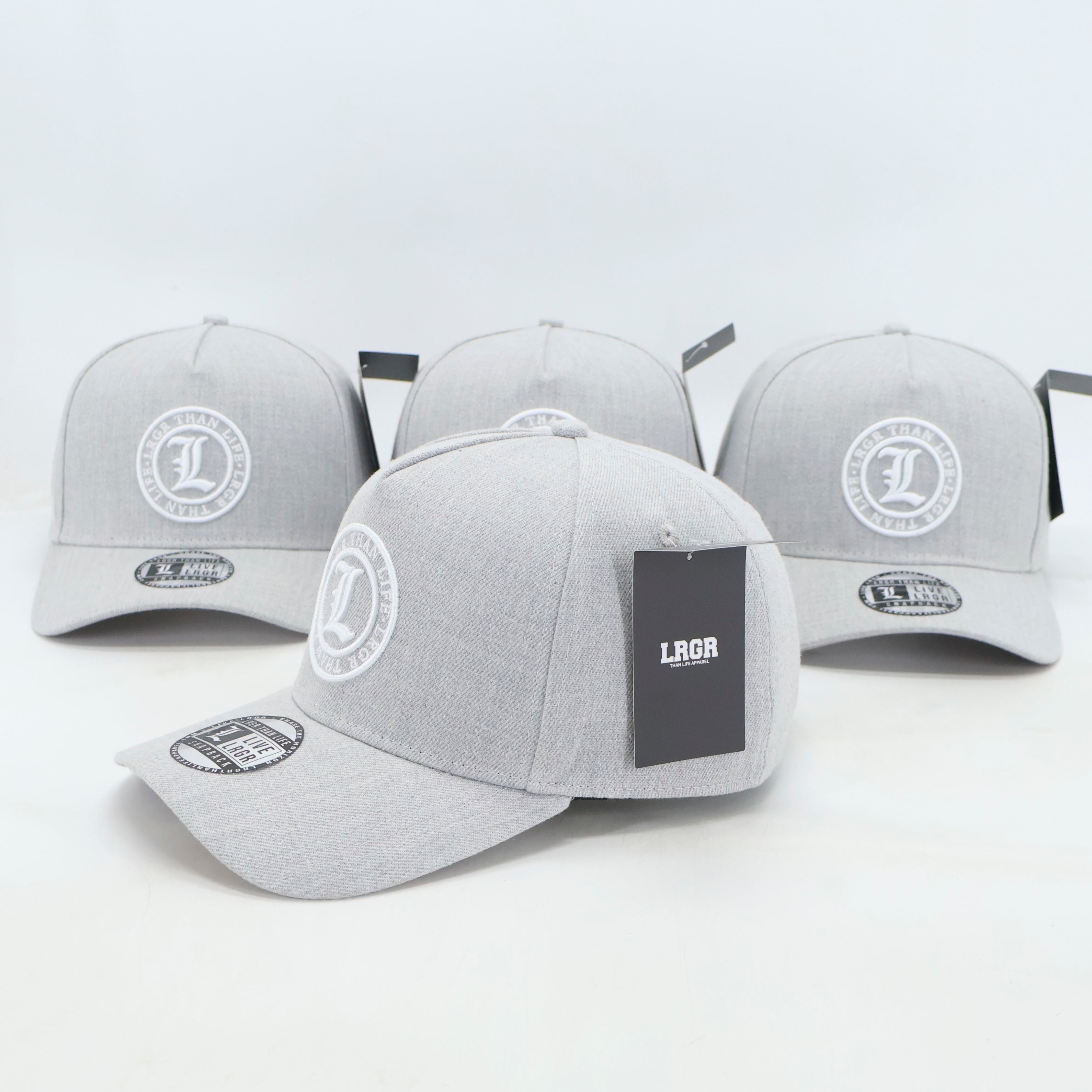 Gray baseball caps with a logo and brand name on a light gray background
