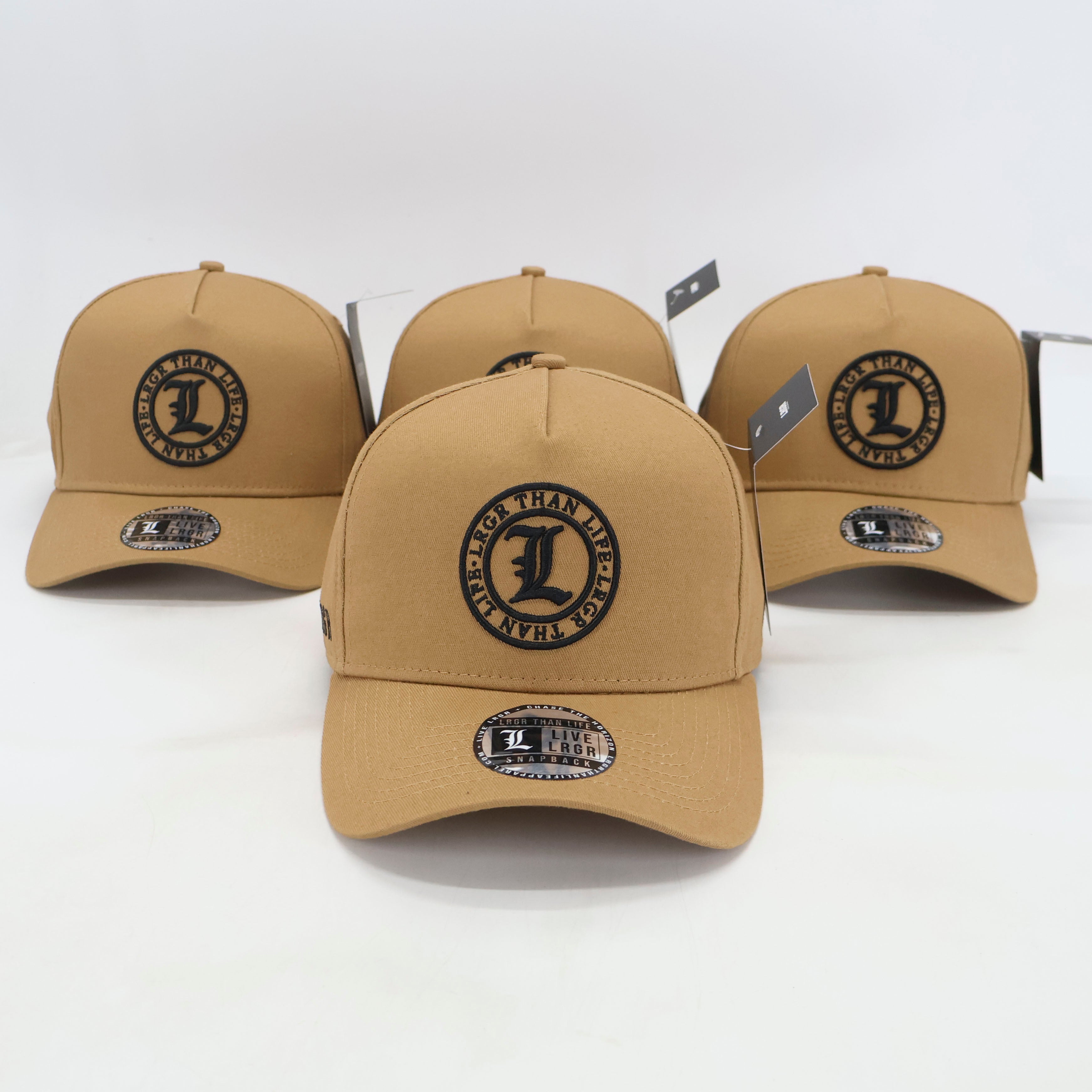 Three tan baseball caps with a logo on a white background