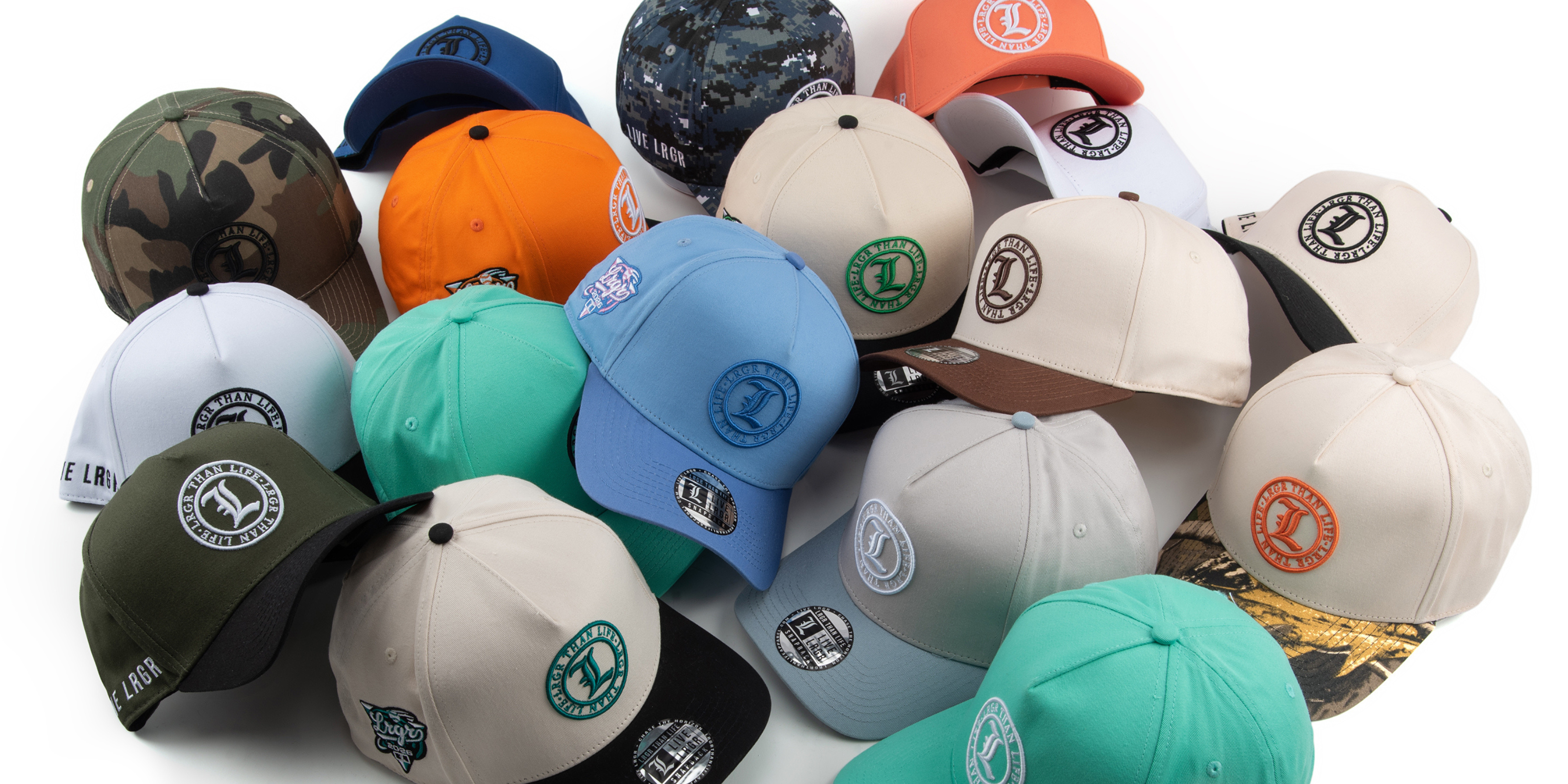 Collection of various baseball caps with different colors and logos on a white background
